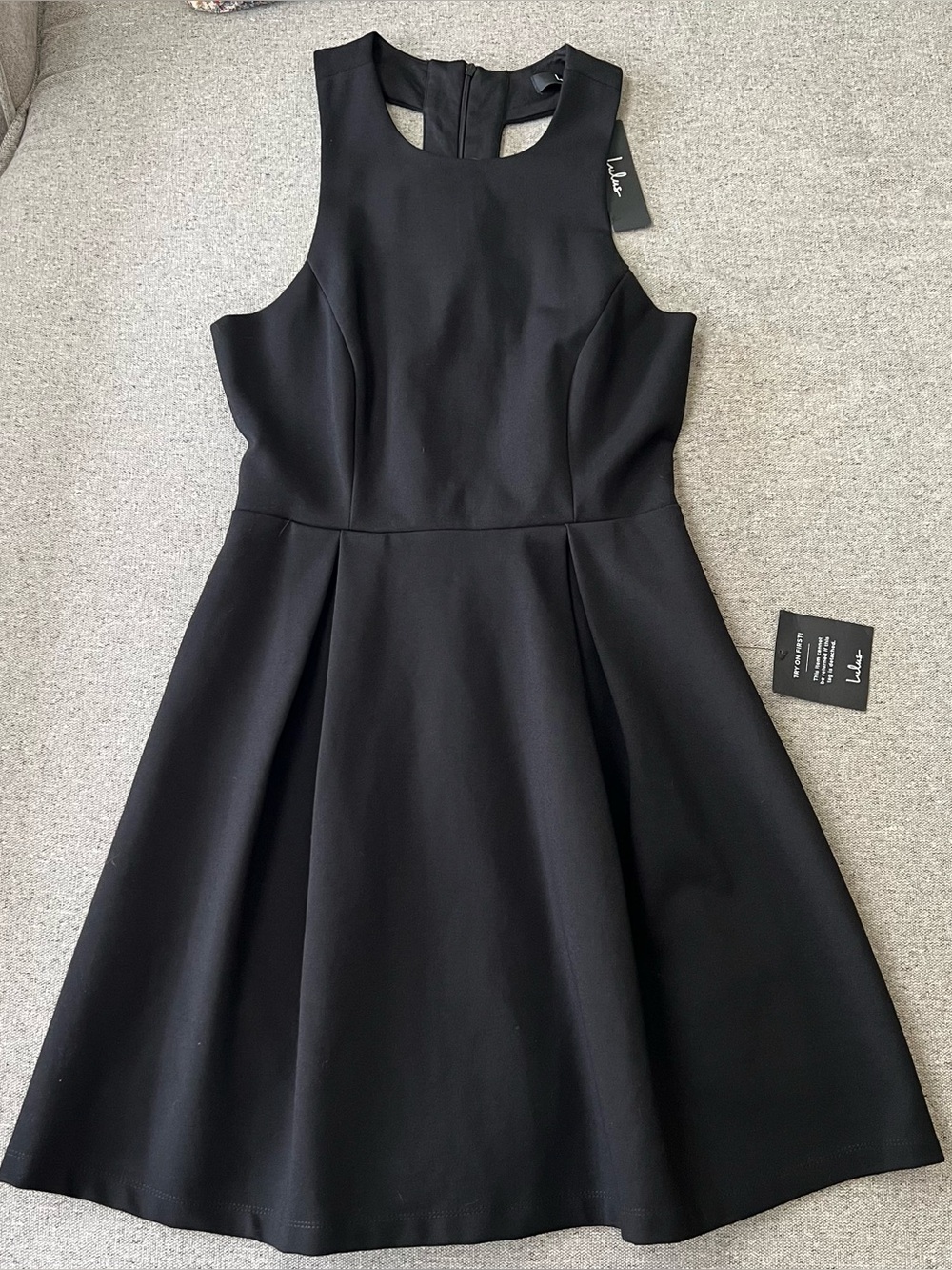 Lulus dress open back cutout and about new with tags